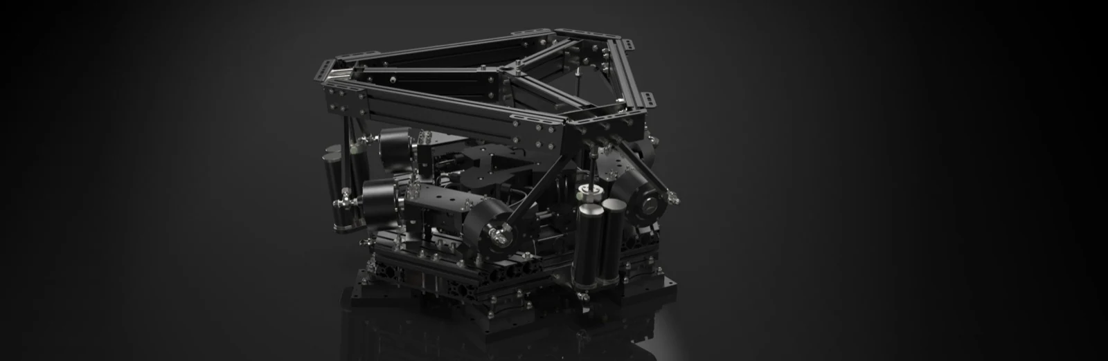 The PDK motion base seen three-quarters on: a triangular platform carried by three motor blocks, con rods and pneumatic cylinders, on a black studio set
