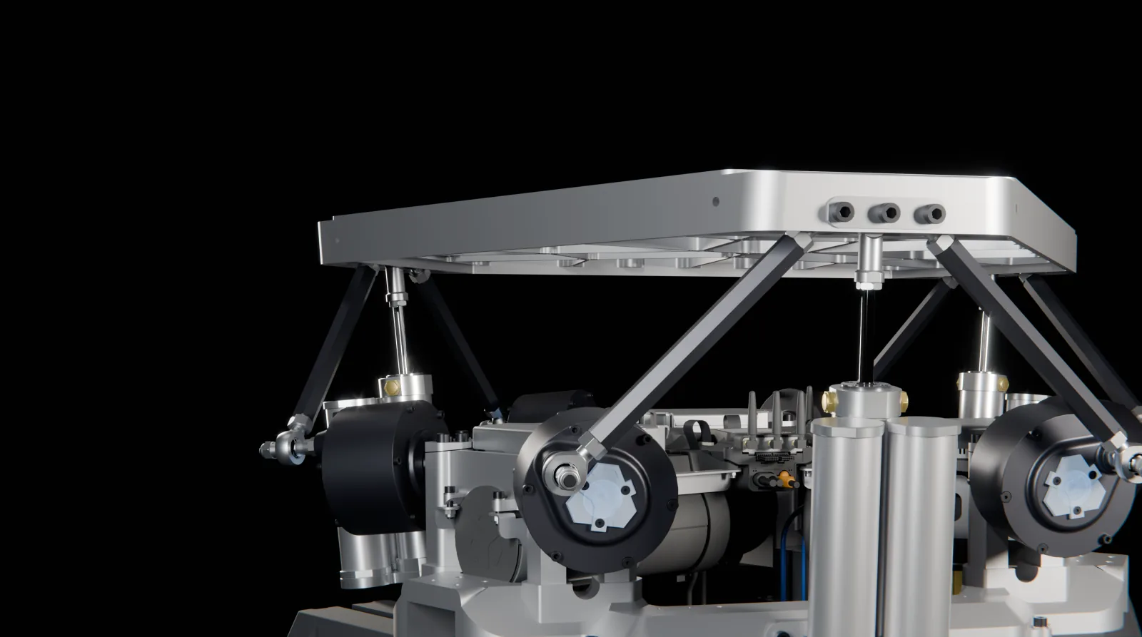 The PDK close up: a direct-drive motor block, the connecting rods and a pneumatic leg under the platform, lit on black
